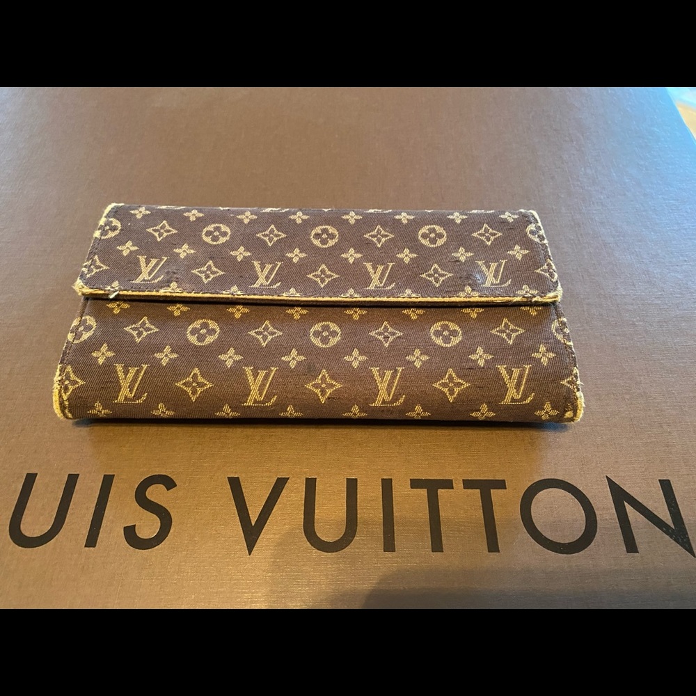Louis Vuitton canvas wallet.